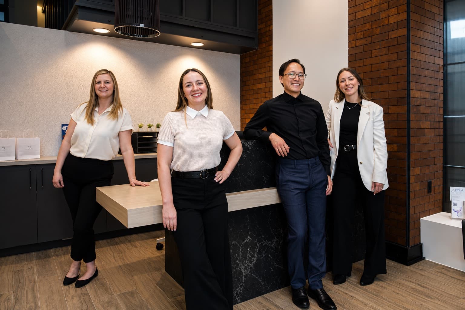 The Dental at the Bow team beside the reception desk